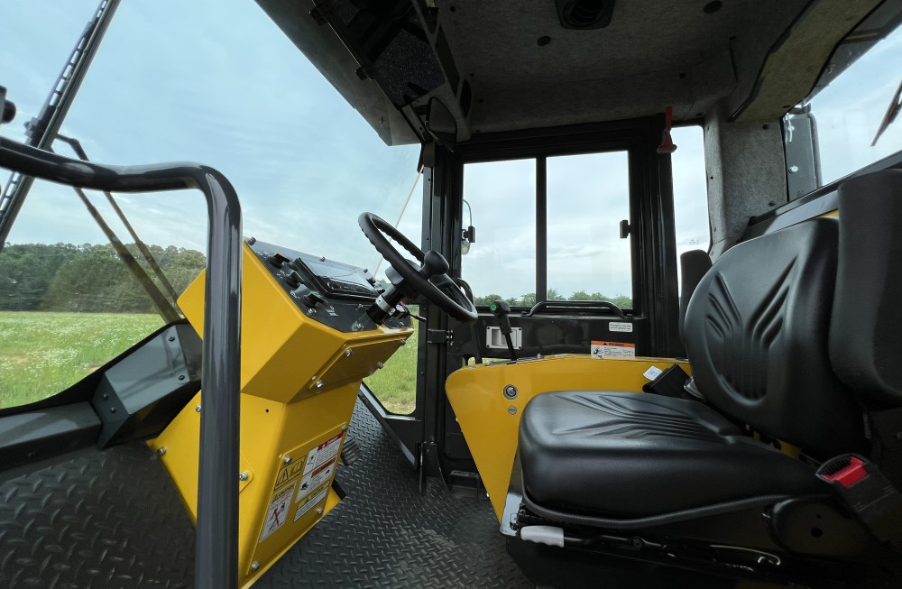 Entry door view of the inside of the SAKAI SV544 or SV414 soil compactor optional enclosed operator cab.