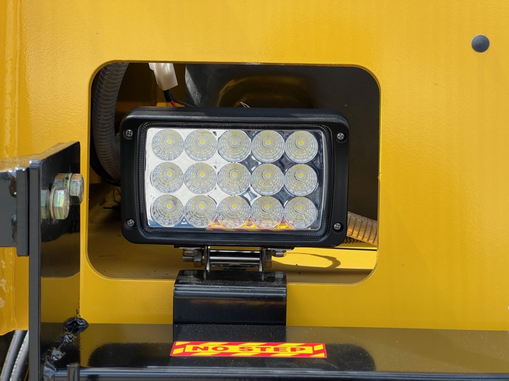 Close up of front upgraded LED light assembly on the SAKAI GW754 vibratory pneumatic tire roller or traffic roller.