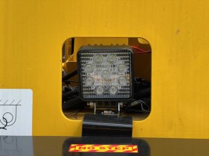 Close up of rear upgraded LED light assembly on the SAKAI GW754 vibratory pneumatic tire roller or traffic roller.