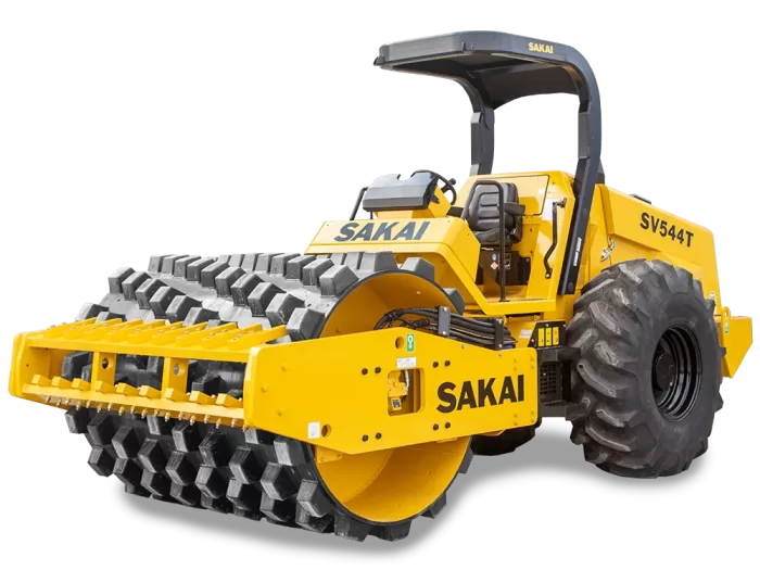 A yellow Sakai SV544T 84 inch 12 ton soil compactor with padfoot or sheeps foot drum and lug tires.