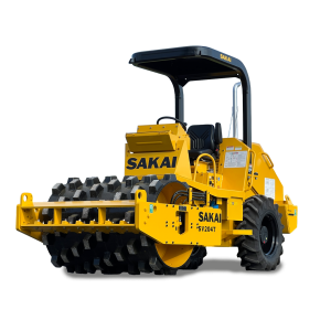 A SAKAI SV204T 5 ton vibratory padfoot soil compactor or dirt roller for residential site work or trench and utility work.